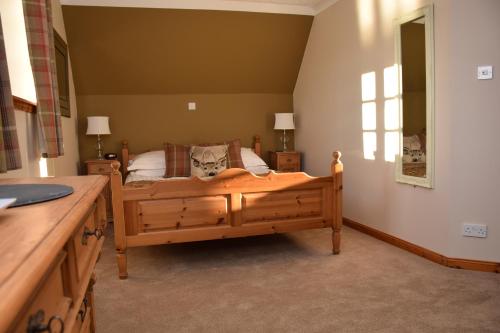 A bed or beds in a room at Lochview Guesthouse