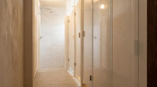 a bathroom with a walk in shower and a glass shower stall at Casa Chati Hostal Boutique in San Cristóbal de Las Casas