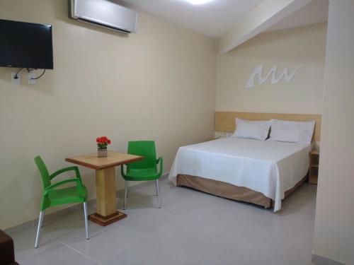 En eller flere senge i et værelse på Hotel Parque das Aguas