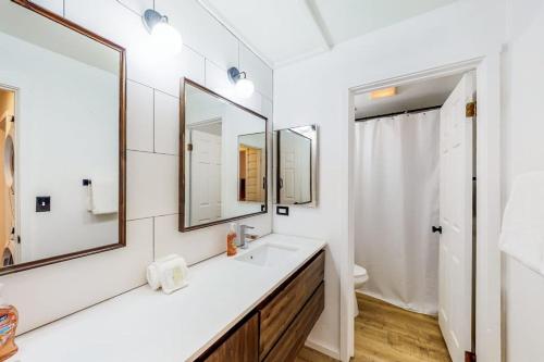 a bathroom with a sink and two mirrors at Fun In the Sun Valley in Sun Valley