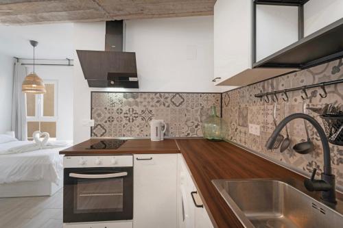 a kitchen with a sink and a counter top at Apartamento La Pista Sur in San Sebastián de la Gomera