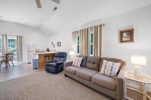 a living room with a couch and a chair at Chris Cottage 3 in Chincoteague