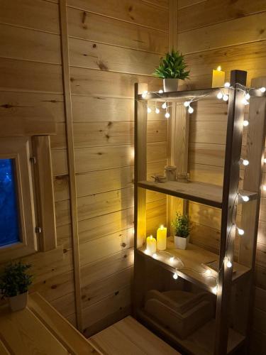 a room with a sauna with candles and lights at 'Белый дом' in Balqash