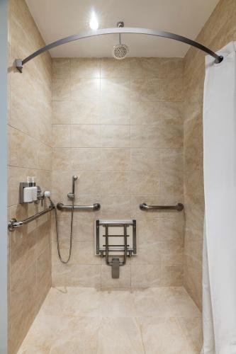 a shower stall with a shower curtain in a bathroom at Holiday Inn Express Quito by IHG in Quito