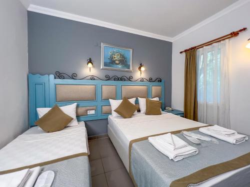 Postel nebo postele na pokoji v ubytování Hotel Atrium