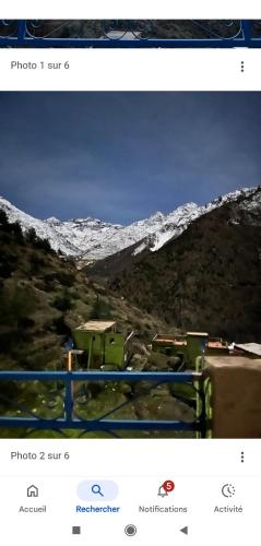 a screenshot of a picture of a snow covered mountain at Imlil agarssiwal in Aguersioual