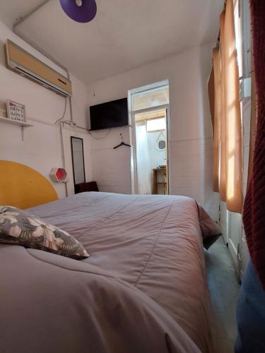 a bedroom with a large bed with a window at Why Not Nueva Cordoba in Córdoba