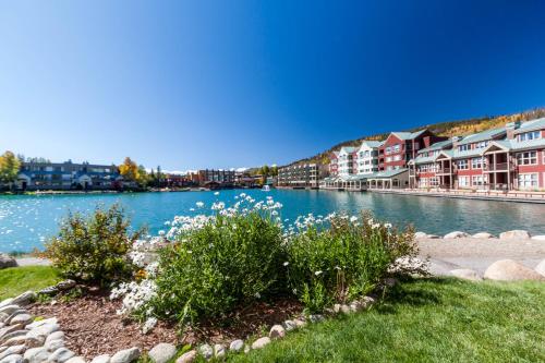 a view of a river with houses and flowers at Willows #1704 in Keystone