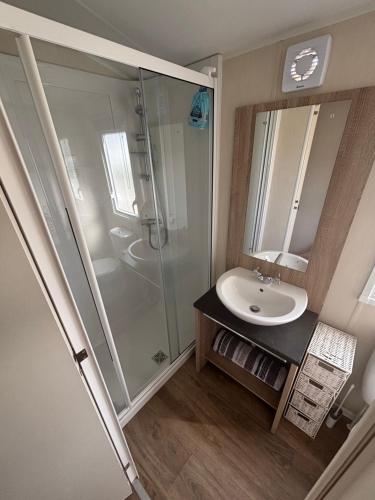 a bathroom with a shower and a sink at Seaview Holiday Rentals - Etchingham in Chestfield