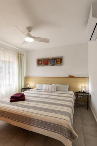 a bedroom with a large bed with a ceiling at Apartament in Monte Pedreguer in Pedreguer