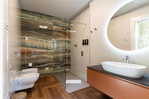 a bathroom with a sink and a mirror at B&B Antenhofer Lovere in Lovere