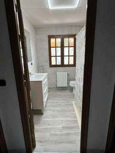 a bathroom with a sink and a toilet at Casa Bartolo in Vélez-Rubio
