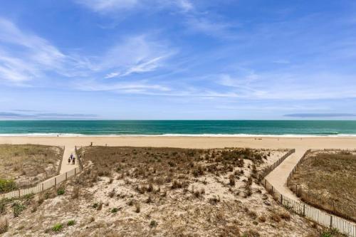 an empty beach with the ocean in the background at Purnell House 402 in Ocean City