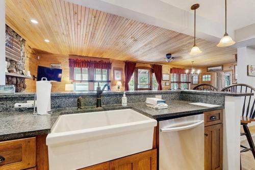 a kitchen with a sink and a counter top at WeSeekANook in Meredith