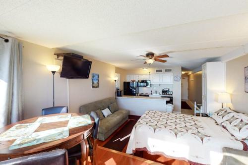 a living room with a bed and a couch at Atlantis 502 in Ocean City