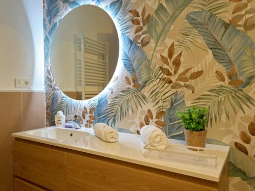 a bathroom with a sink and a mirror at The Lemon Garden Escape in Meta