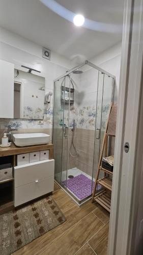 a bathroom with a shower and a sink at Sleep&Fly in Naples