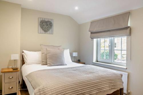 a bedroom with a bed and a window at 2 Bed in Cherry Burton oc-c37535 in Cherry Burton