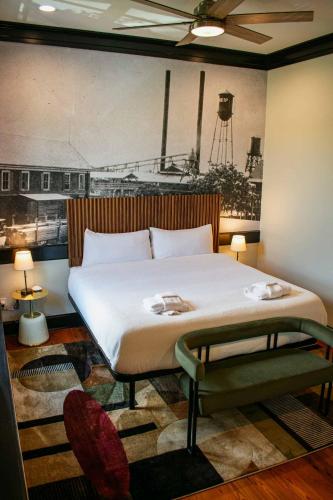 a bedroom with a large bed in a room at The Montgomery by Visit Apalach in Apalachicola