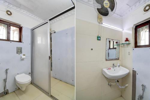 a bathroom with a shower and a toilet and a sink at Hotel Elguse in kolkata