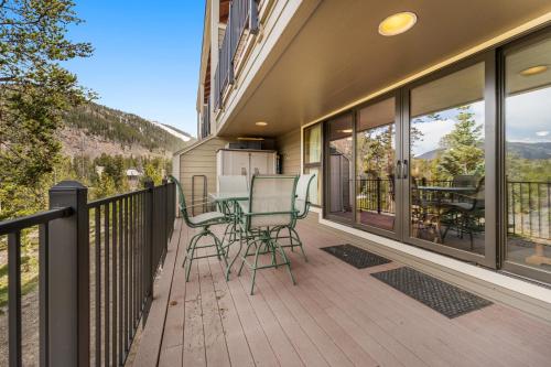 a balcony with a table and chairs on it at Pines #2071 : 2 in Keystone
