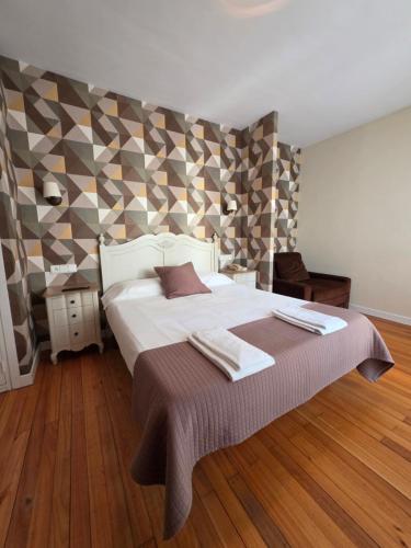 Un pat sau paturi într-o cameră la Hotel & Spa Arha by Maile