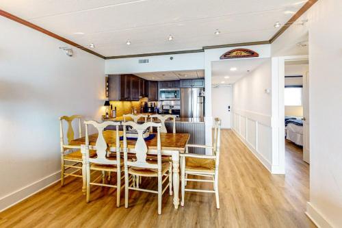 a kitchen and dining room with a table and chairs at Marigot Beach Condo in Ocean City