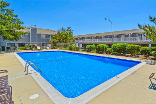 a large swimming pool in front of a building at Nassau Village 24 in Ocean City