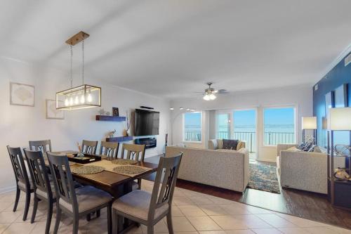 a dining room and living room with a table and chairs at Cori Noel 102 in Ocean City