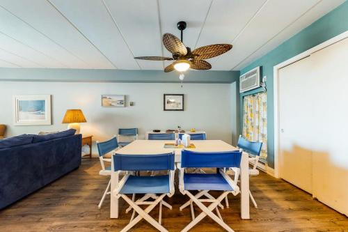 a dining room with a table and chairs and a couch at Highpoint S 3G in Ocean City