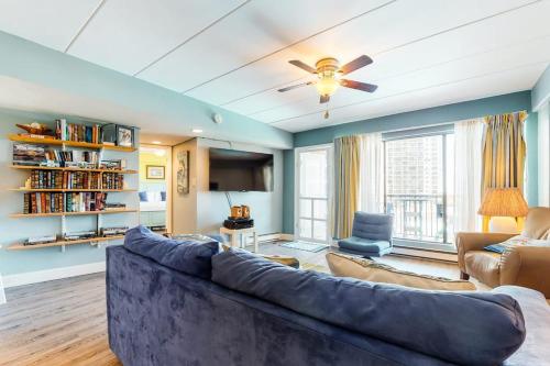 a living room with a large couch and a ceiling fan at Highpoint S 3G in Ocean City
