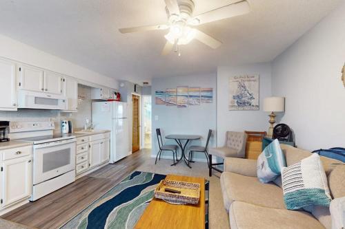 a kitchen and living room with a couch and a table at Sea Nymph in Ocean City