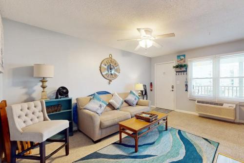 a living room with a couch and a table at Sea Nymph in Ocean City