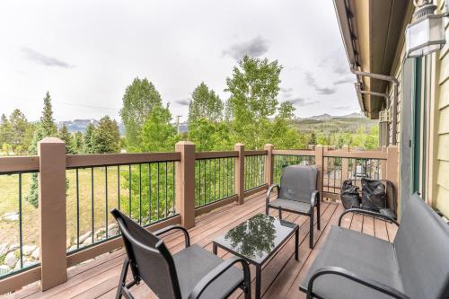 a balcony with chairs and a table with a view at Highland Greens Lodge #311 in Breckenridge