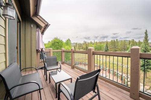 a balcony with chairs and a table with a view at Highland Greens Lodge #311 in Breckenridge