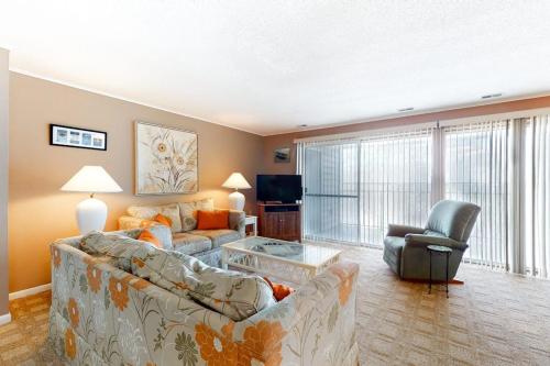 a living room with a couch and a chair at Thunder Island 28A in Ocean City