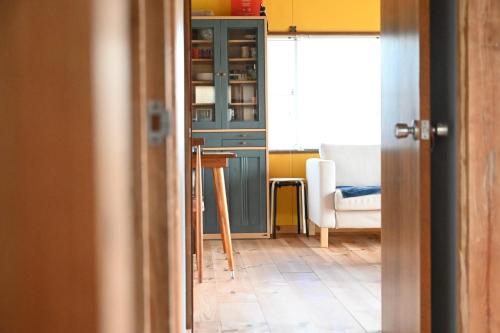 a room with a blue cabinet and a table at TORAMIKE2 - Vacation STAY 53883v in Ichigaya