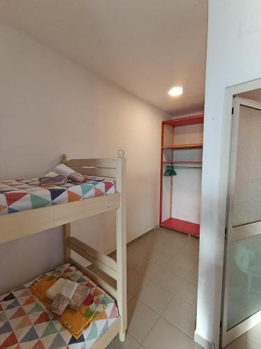 a small room with a bunk bed and a closet at Te Shkodrant in Baks-Rrjoll