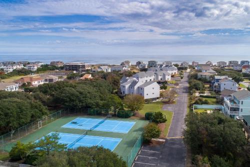 an aerial view of a tennis court and houses at 4218 - The Scotts' SandBar in Duck