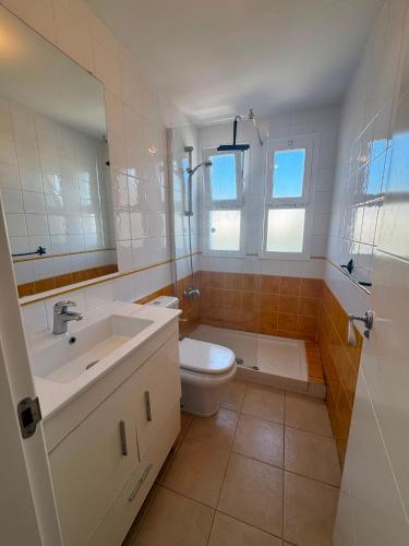 a bathroom with a sink and a toilet and a shower at BLUE Dreams in Mijas Costa
