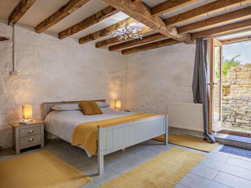 a bedroom with a bed and a large window at 1 Bed in Taunton oc-87929 in Pitminster
