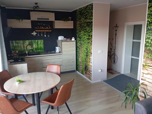 a kitchen and dining room with a table and chairs at Luxor4 in Kaštela
