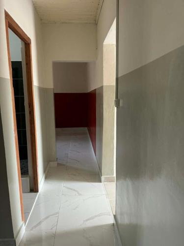 an empty hallway in a room with a wall at Logis Baobab in Morondava