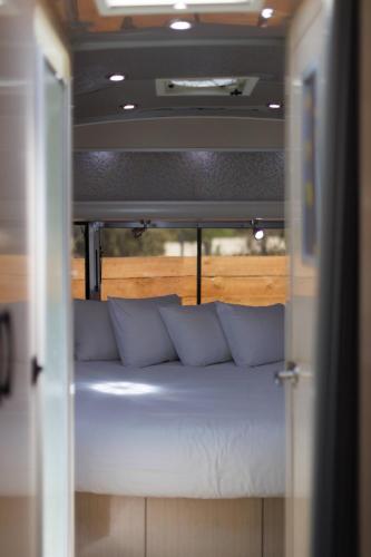 a couch sitting inside of a room with a window at Airstream Dream in Orderville