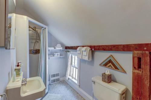 a bathroom with a sink and a toilet and a shower at Mount Holly Home in Mount Holly