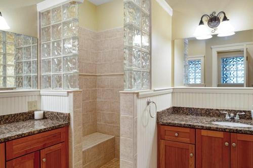 a bathroom with a shower and a sink at Castle Hill Condo in Cavendish