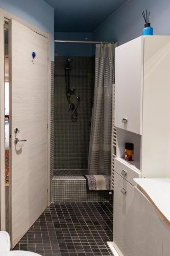 a bathroom with a shower with a shower curtain at AuraVista in Montefiascone