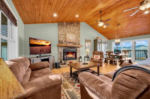 a living room with a couch and a fireplace at Meadow View in Banner Elk