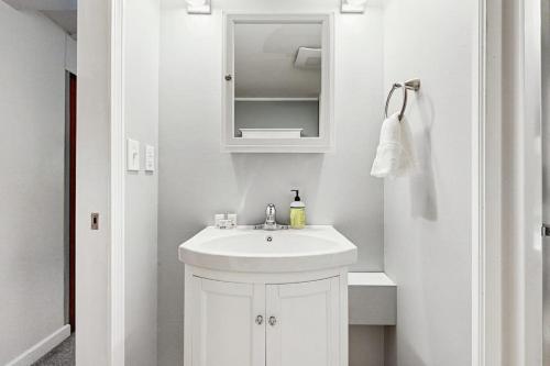a white bathroom with a sink and a mirror at Cozy Dennis Retreat in Bridgewater