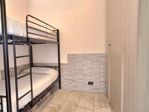 a room with two bunk beds in a room at La Casa di Anastasya in Castiglione Torinese